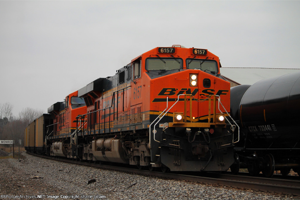 BNSF 6157 leads a coal load sb.